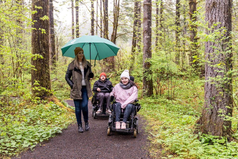 Wheelchair users exploring accessible trails at Tillamook Forest Center, an accessible activity in Tillamook Coast