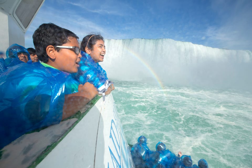 Kids enjoying Niagara Falls from the boat