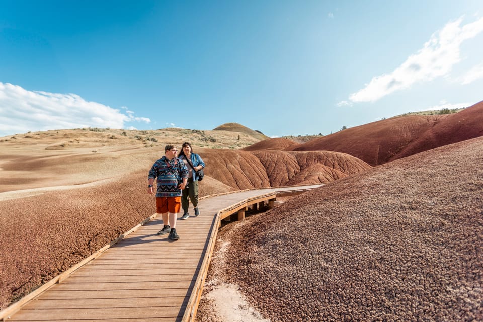 Houston, man with down syndrome, and companion walking along Painted Hills boardwalk